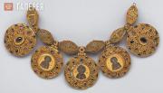 Barmas (bejewelled neckpieces decorated with religious imagery) from a buried tr