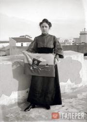 Münter on the Hotel Terrace in Tunisia with Her Beadwork “Volga Ships” based on a Sketch by Kandinsky Münter on the Hotel Terrace in Tunisia with Her Beadwork “Volga Ships”